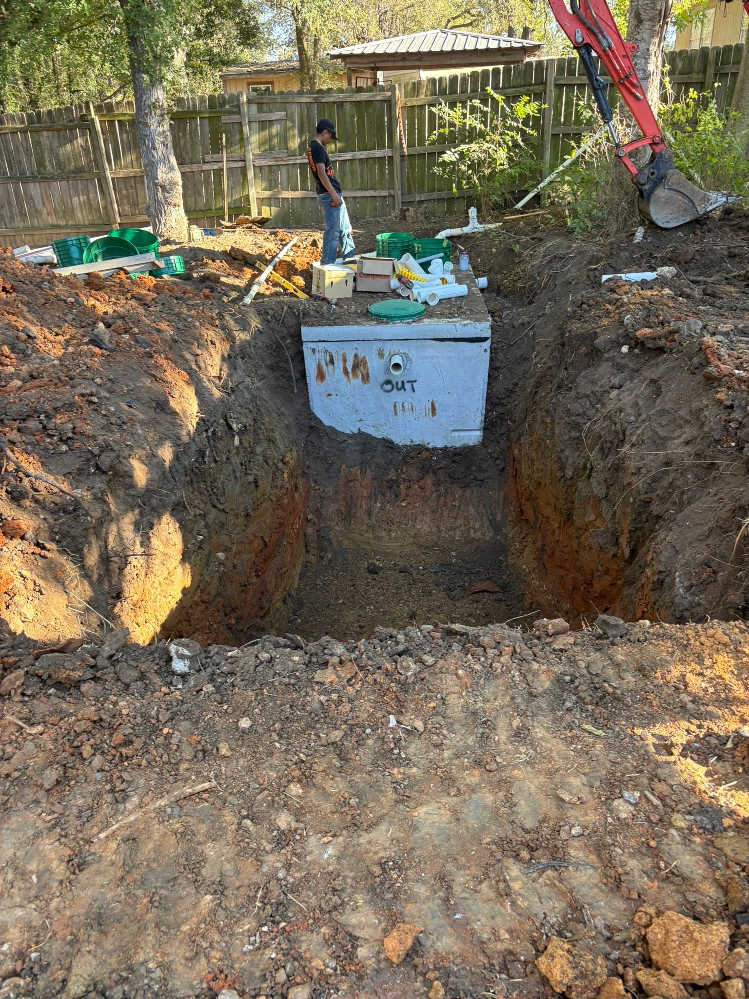 Septic tank excavation with heavy equipment
